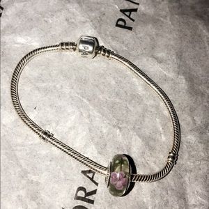 Authentic Pandora bracelet with one flower charm